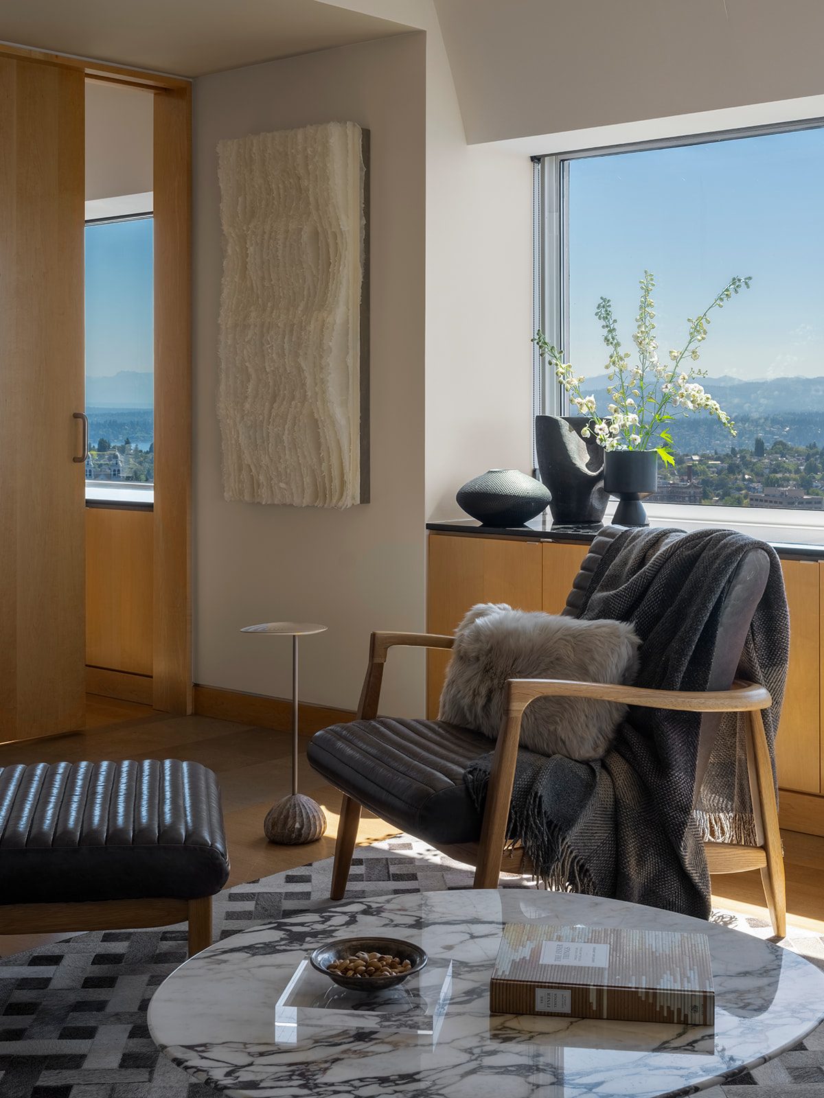 Living area with carefully composed furniture and materials, First Hill Penthouse — First Hill, Seattle