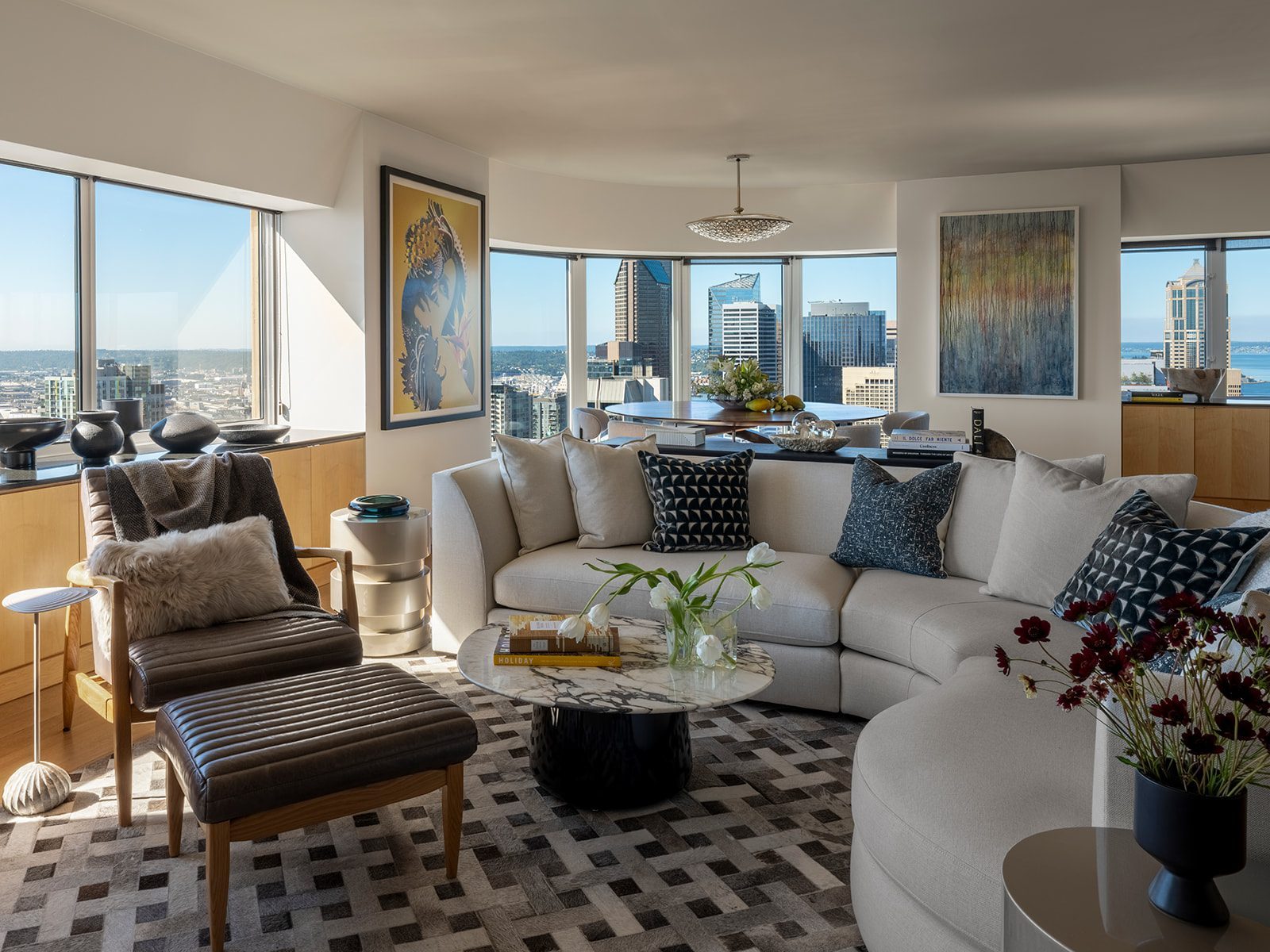 Open kitchen with clean-lined cabinetry and warm accents, First Hill Penthouse — First Hill, Seattle